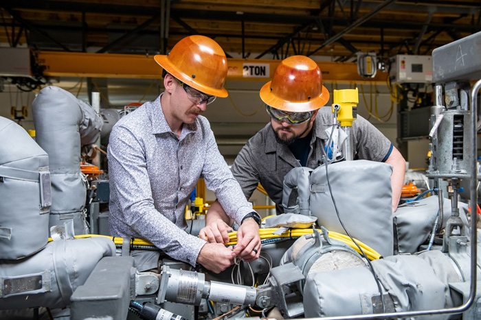 Workers handling wires